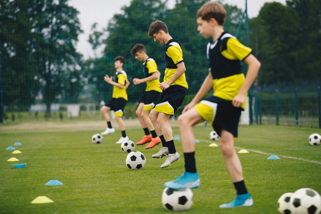 Middle School Students Performing Soccer Drills